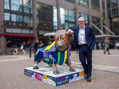 West Midlands Mayor Richard Parker stood next to a bull sculpture