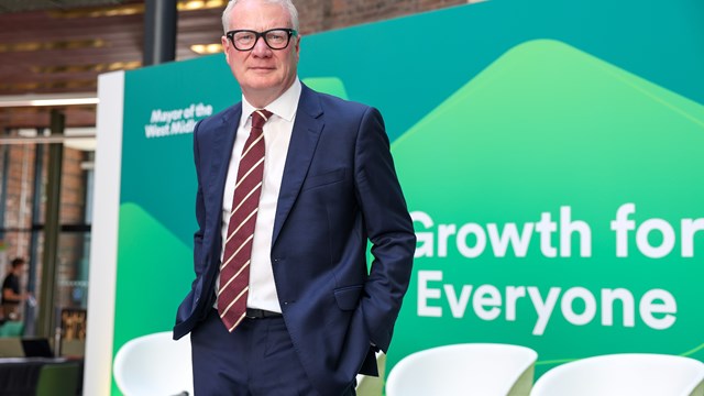 Richard Parker, West Midlands Mayor standing on the stage at the Growth Plan Launch.