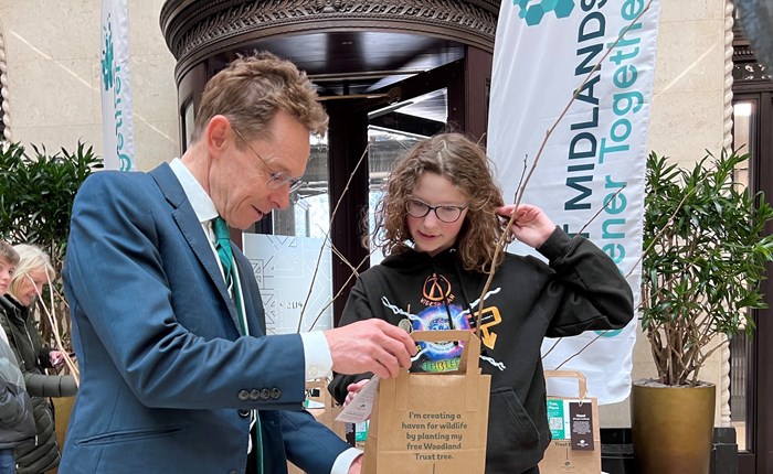 Andy Street, Mayor of the West Midlands, hands a free Woodlands Trust sapling to 13-year-old Betty Green as part of the WMCA's Right Tree, Right Place campaign earlier this year